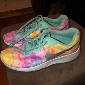 I’m selling these rainbow Nike kid shoes
